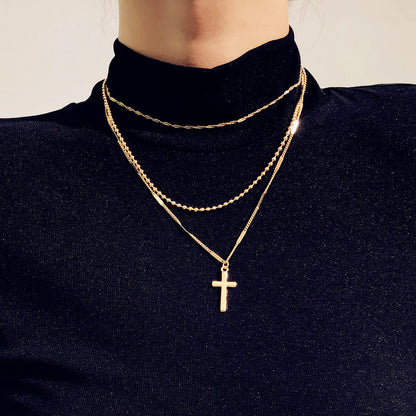 Gold Layered Cross Necklace with Three-Tier Pendant