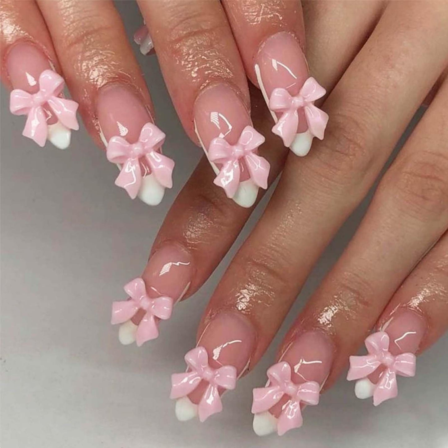 Almond Fake Nails Medium Press on Nails French Tip False Nails with Bow Design Pink Acrylic Nails Glossy Artificial Glue on Nails Full Cover Stick on Nails for Women Girls Manicure Decoration 24Pcs
