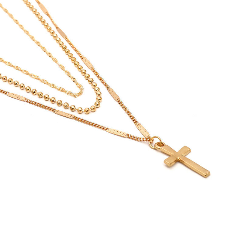 Gold Layered Cross Necklace with Three-Tier Pendant