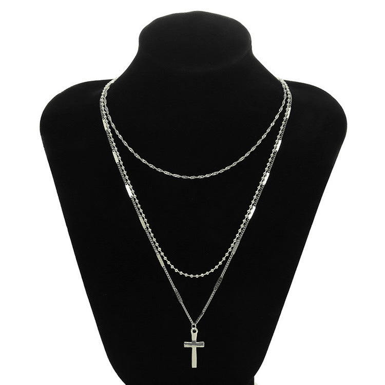 Gold Layered Cross Necklace with Three-Tier Pendant