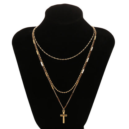 Gold Layered Cross Necklace with Three-Tier Pendant