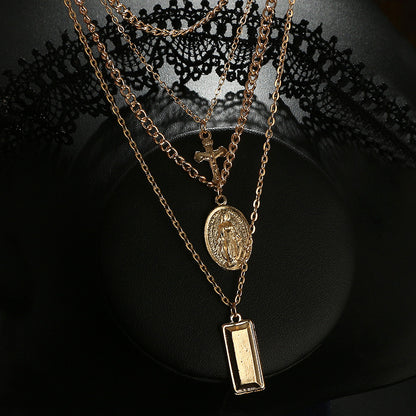 Multi-Layer Necklace with Cross and Virgin Mary Design